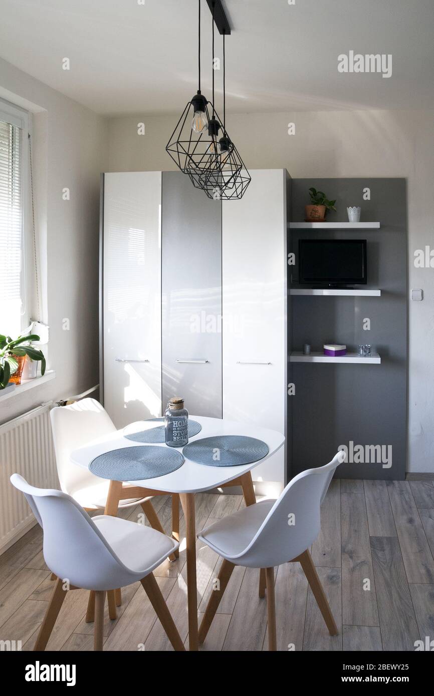 Modern stylish Scandinavian kitchen interior with kitchen accessories.  Bright white and grey kitchen with household items in studio apartment  Stock Photo - Alamy