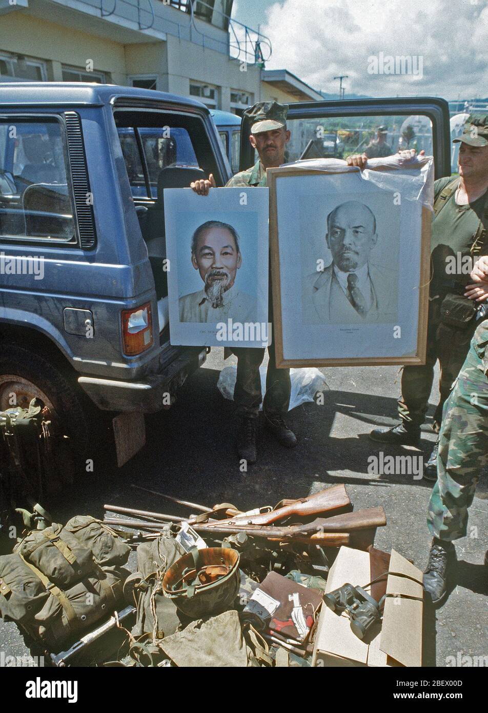U.S. Marines display portraits of Ho Chi Minh and Vladimir Ilyich Lenin that were seized at Pearls Airport during the multi-service, multinational Operation Urgent Fury in Grenada. Stock Photo