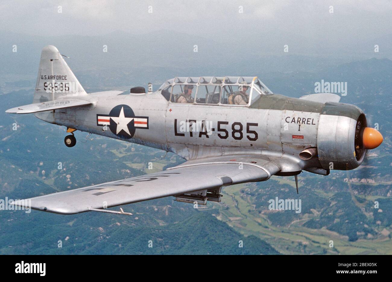 A U.S. Air Force LT-6G aircraft flies in the demilitarized zone over South Korea in the fall of 1953. The North American Aviation T-6 Texan was modified during the Korean War for battlefield surveillance and forward air control, and designated as T-6 'Mosquitos.'  The photo was taken by U.S. Air Force pilot Alexander P. Macdonald. He later became the North Dakota Air National Guard's 119th Fighter Group commander Feb. 28, 1968. He was promoted to brigadier general Dec. 14, 1981 and major general in June, 2983. He was appointed as the North Dakota adjutant general in August, 1984. Stock Photo