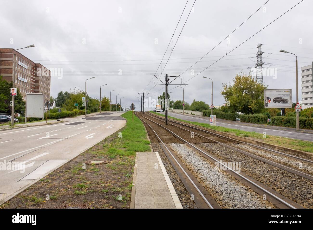 Tramlines on Allee der Kosmonauten, on an overcast day, in Marzahn, Berlin, Germany Stock Photo