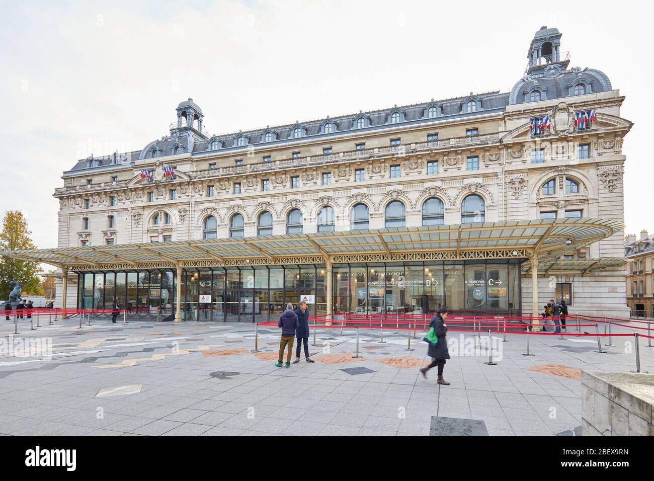 PARIS, FRANCE - NOVEMBER 8, 2019: Gare D'Orsay or Orsay museum building with people in a cloudy morning in Paris Stock Photo