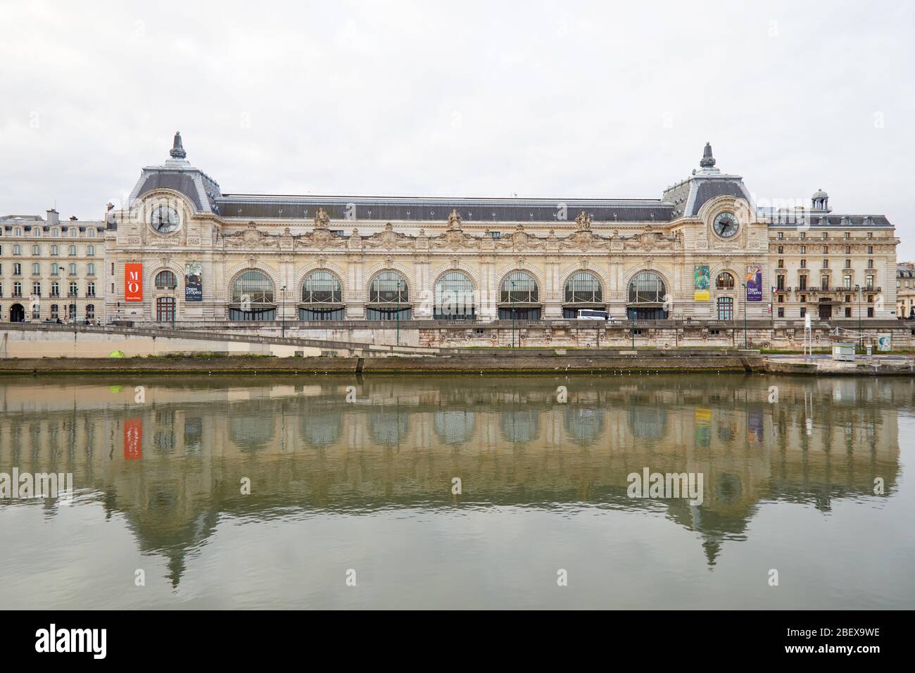 PARIS, FRANCE - NOVEMBER 8, 2019: Gare D'Orsay or Orsay museum building frontal view and Seine river in a cloudy day in Paris Stock Photo