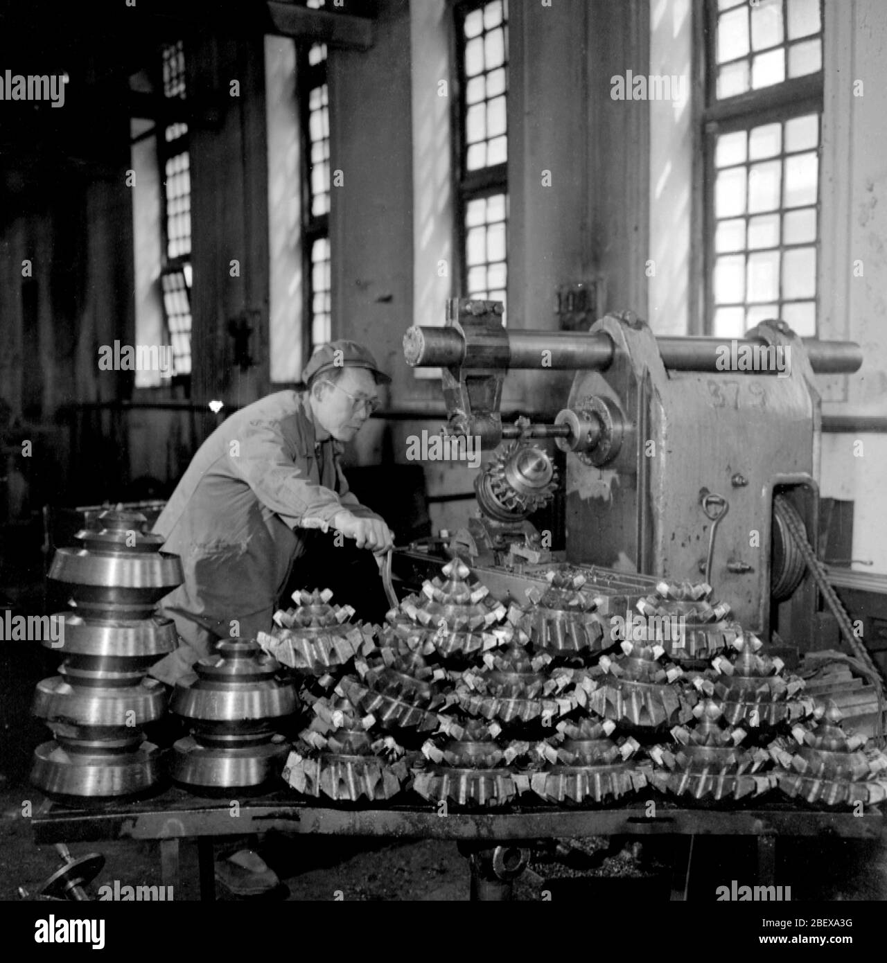 In July 1961 workers at the Gansu Yumen Oil Mining Machinery Plant used self-made machine tools to make drill bits Stock Photo