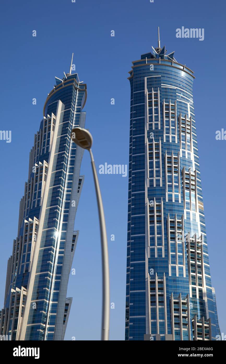 DUBAI, UNITED ARAB EMIRATES - NOVEMBER 23, 2019: JW Marriott Marquis Dubai, luxury twin skyscrapers in a sunny day, clear blue sky Stock Photo