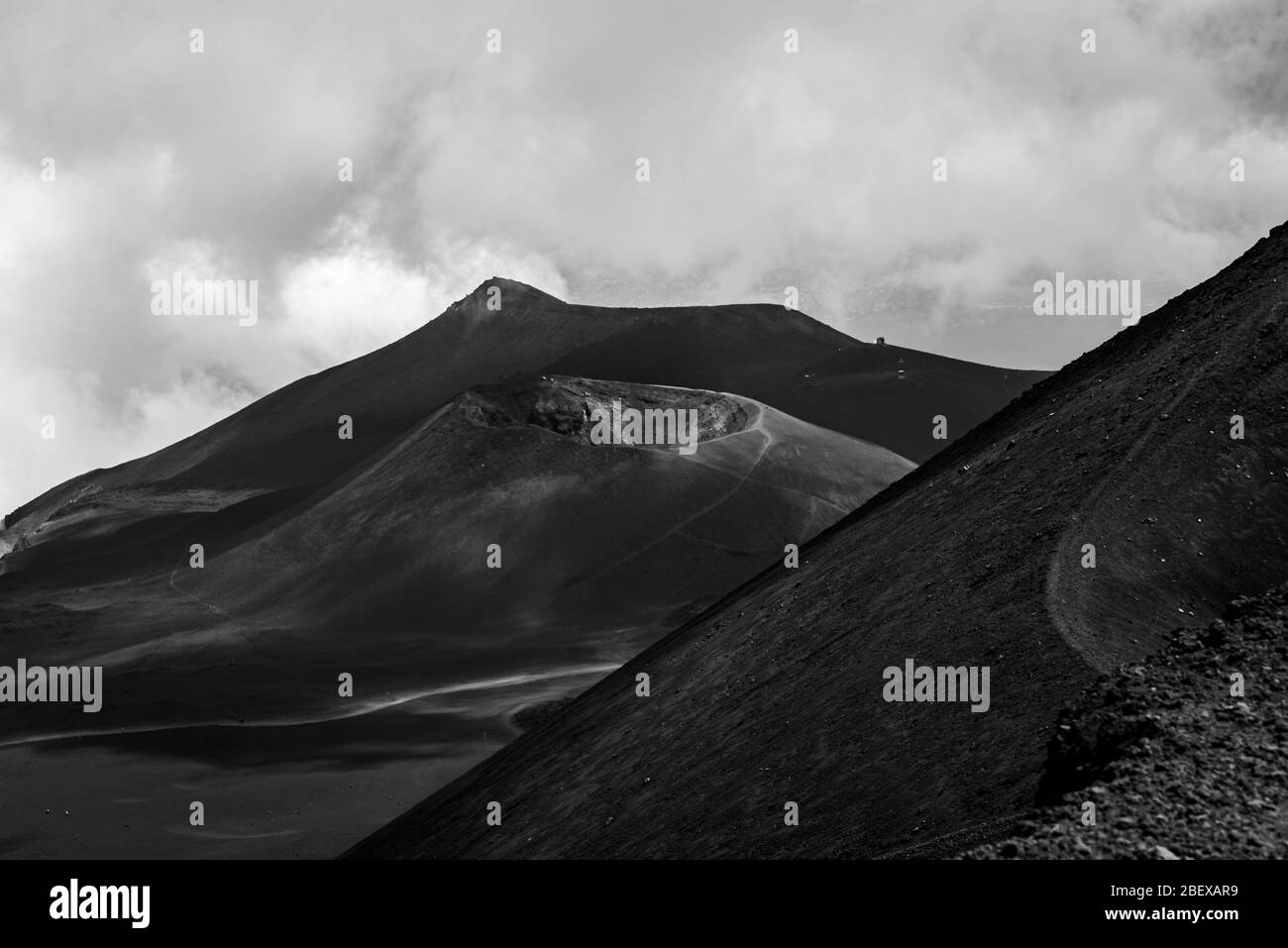 Black and white photo of the beautifully shaped craters of Mount Etna, Sicily. Mount Etna is the highest active volcano in Europe Stock Photo