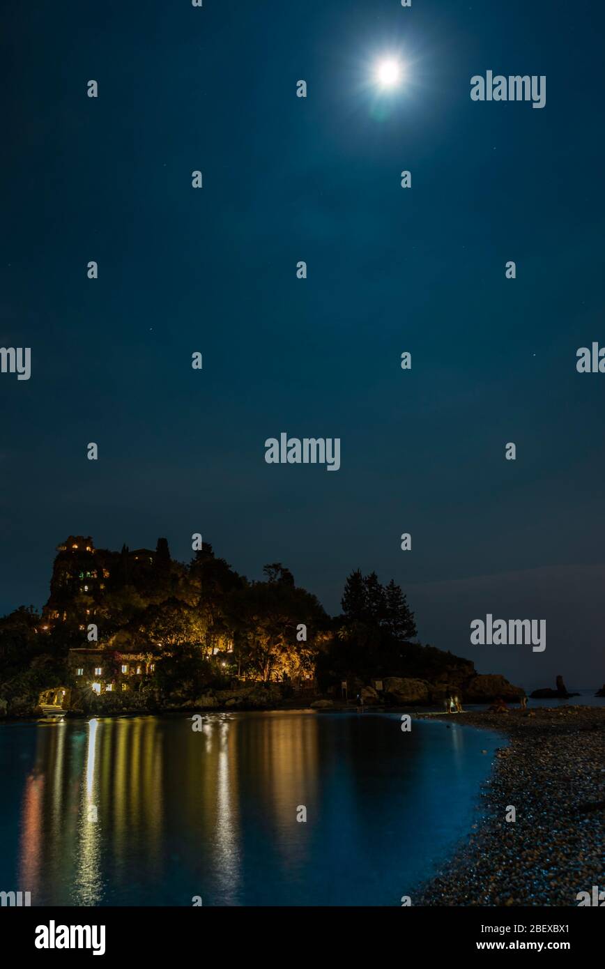 Low angle view of the island Isola Bella Nature Reserve by night at moon light, in Taormina, Sicily Stock Photo - Alamy