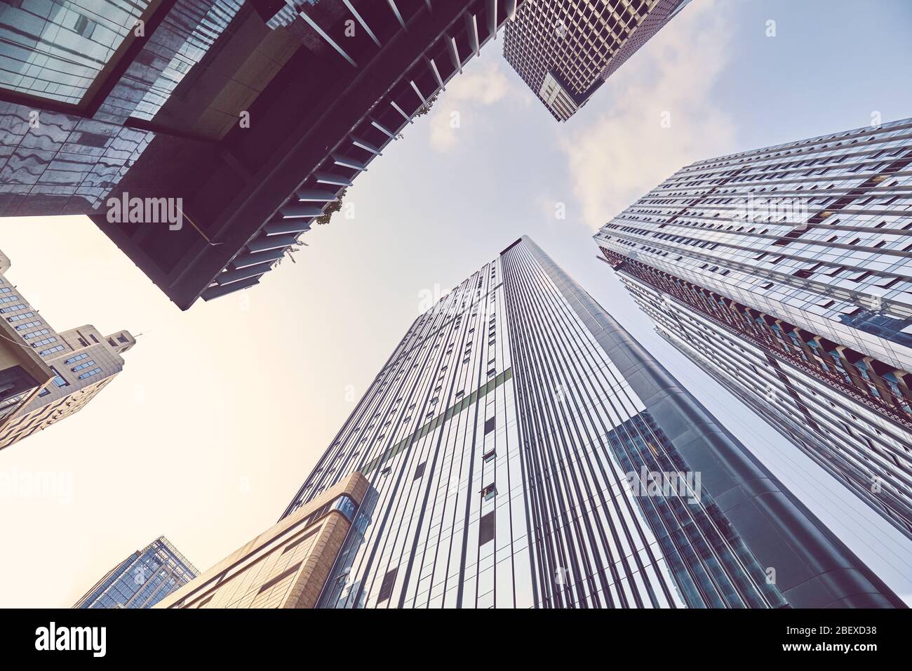 Looking up at skyscrapers in downtown Chengdu, color toned picture, China. Stock Photo