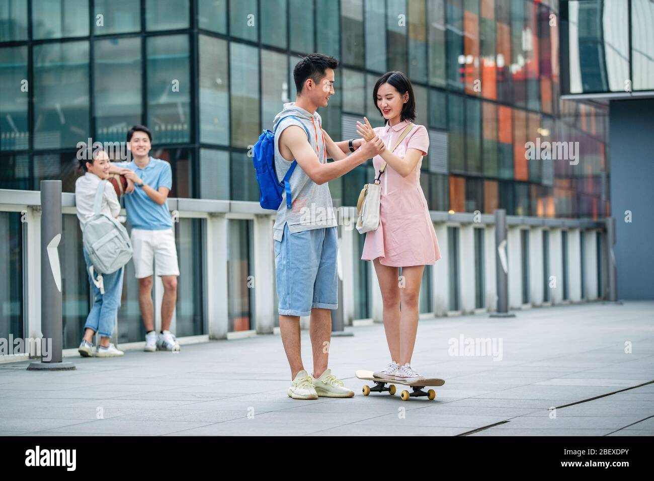 Handsome students goddaughter friend skateboarding Stock Photo