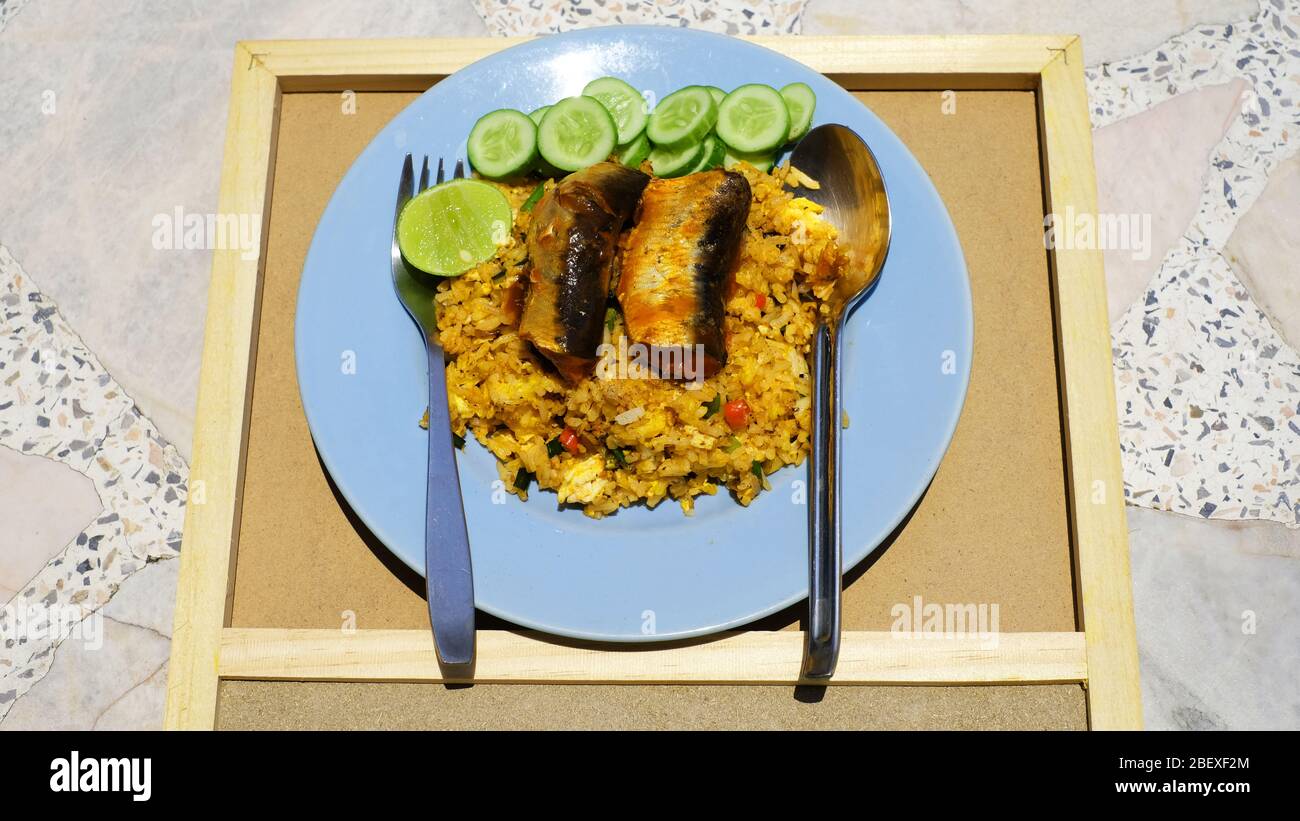 Fried rice with tuna fish on top in blue plate Stock Photo Alamy