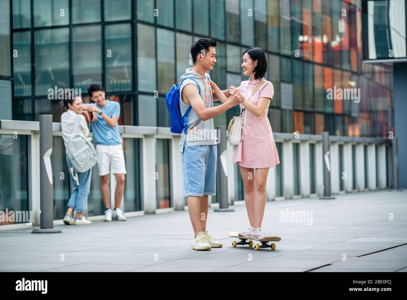 Handsome students goddaughter friend skateboarding Stock Photo