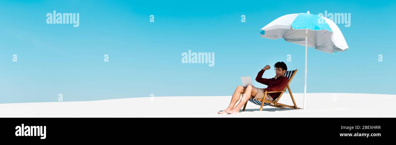 Man Sitting In Beach Chair With Laptop High Resolution Stock Photography And Images Alamy