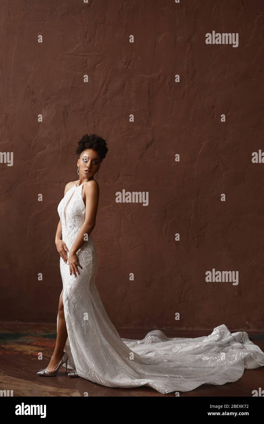 Full Length Shot Of Attractive Black Woman In A Beautiful Dress African Female Fashion Model Standing Over Brown Background Stock Photo Alamy