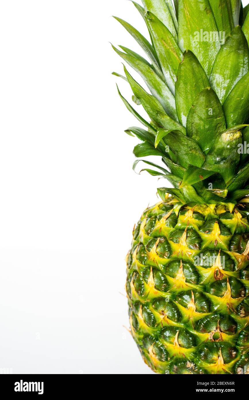 A whole pineapple against a plain white background Stock Photo