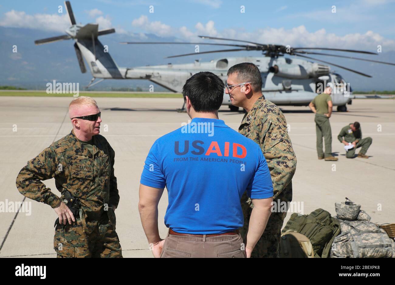 SOTO CANO AIR BASE, Honduras (Oct. 4, 2016) Sgt. Major Wesley L. Schaffer (right), Marine Air-Ground Task Force Southern Command Sgt Major, Albert Gembara (center), U.S Agency for International Development/Office of U.S Foreign Disaster Assistance humanitarian assistance advisor and Col. Thomas E. Prentice (left), Special Purpose Marine Air-Ground Task Force - Southern Command (SPMAGTF-SC) commanding officer speak prior to embarking aboard CH-53E Super Stallion and depart to Grand Cayman Island at Soto Cano Air Base, Honduras. The SPMAGTF-SC is part of U.S southern Command response team staged Stock Photo