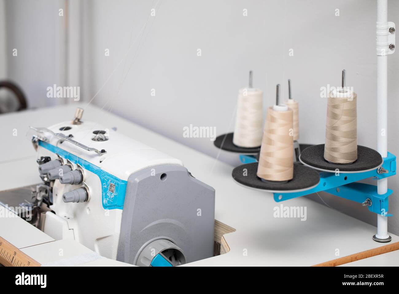 The overlock sewing machine is used to finish the edges of materials