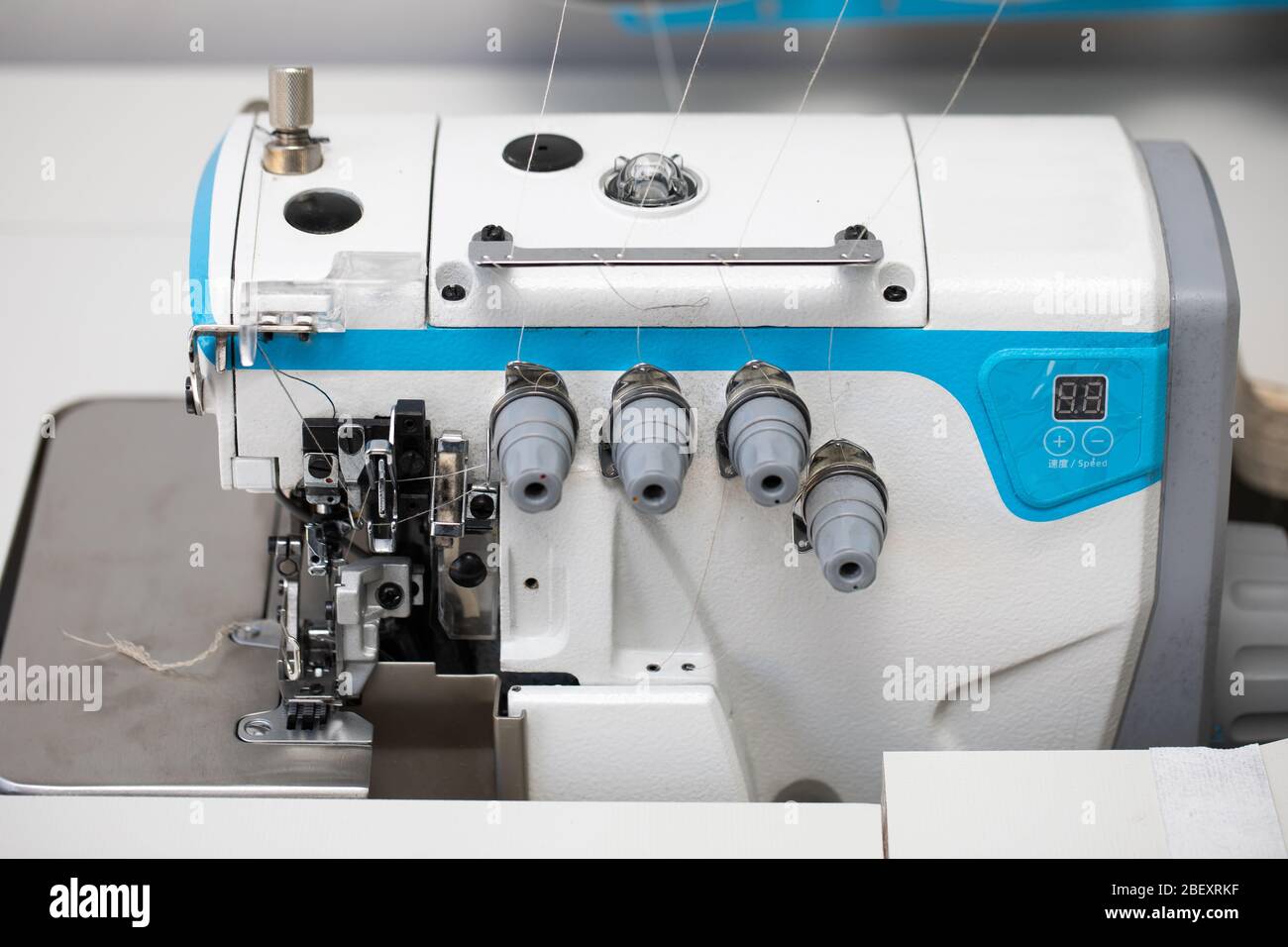 The overlock sewing machine is used to finish the edges of materials