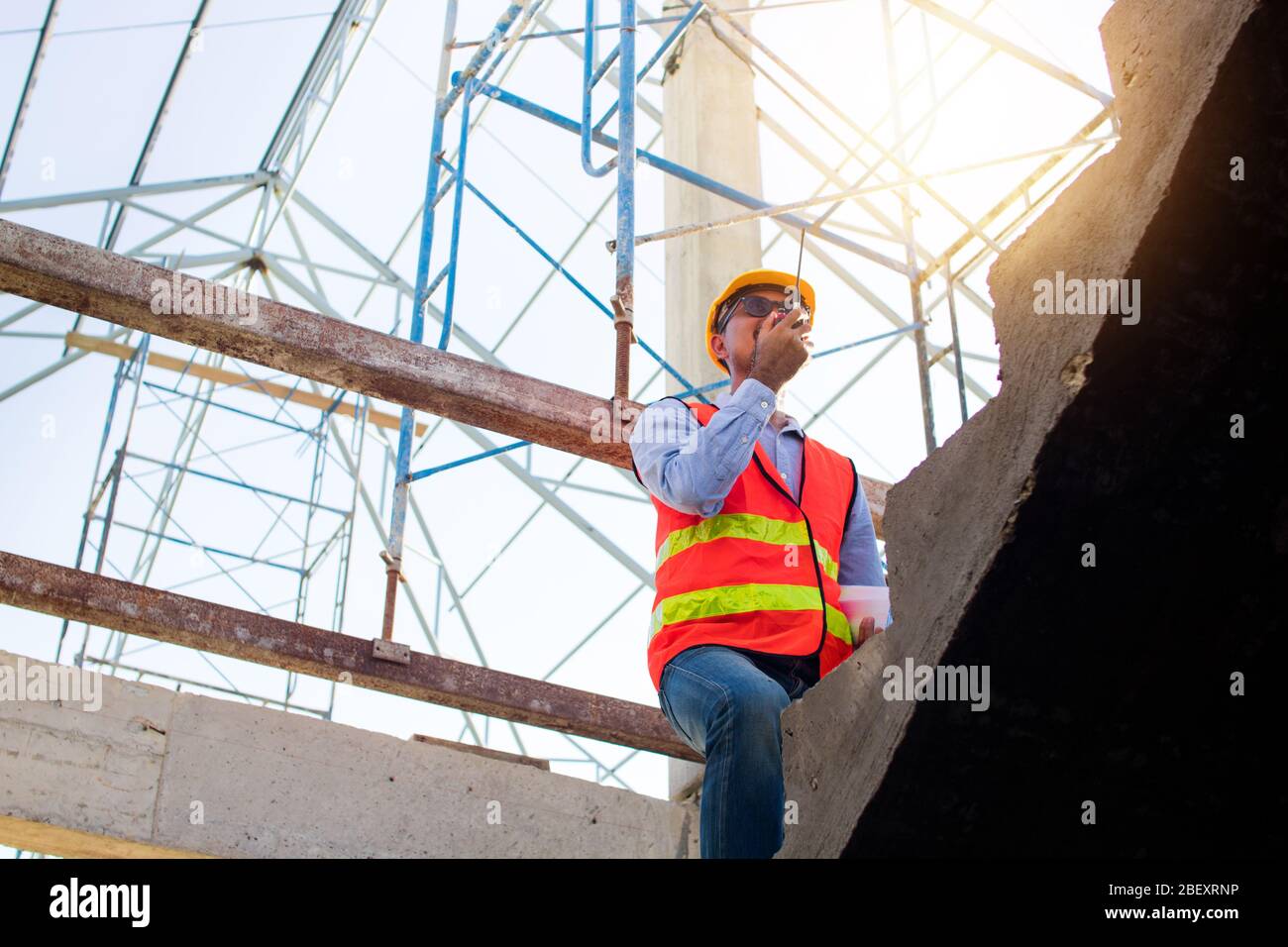 Engineer or inspector checking progressing work in construction site Stock Photo