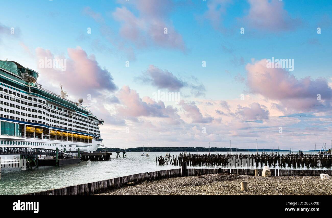 Cruise Ship in Portland by Wood Pilings Stock Photo