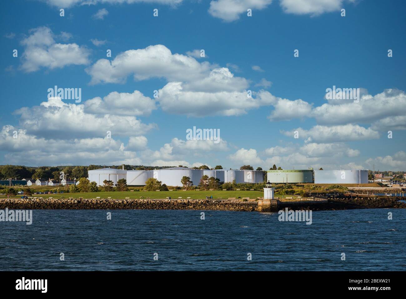 Lighthouse by Old Fuel Tanks Stock Photo Alamy