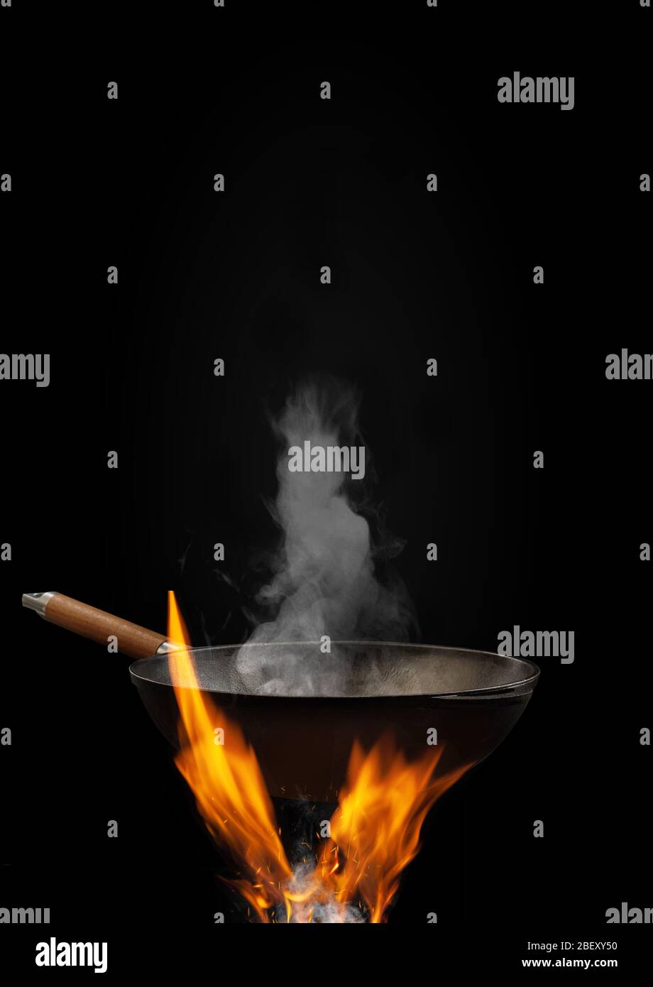 Download Empty Wok Pan With Smoke Above Fire With Sparks Against Black Background Cooking Concept Mockup Template For Your Collage Text Images Close Up Stock Photo Alamy