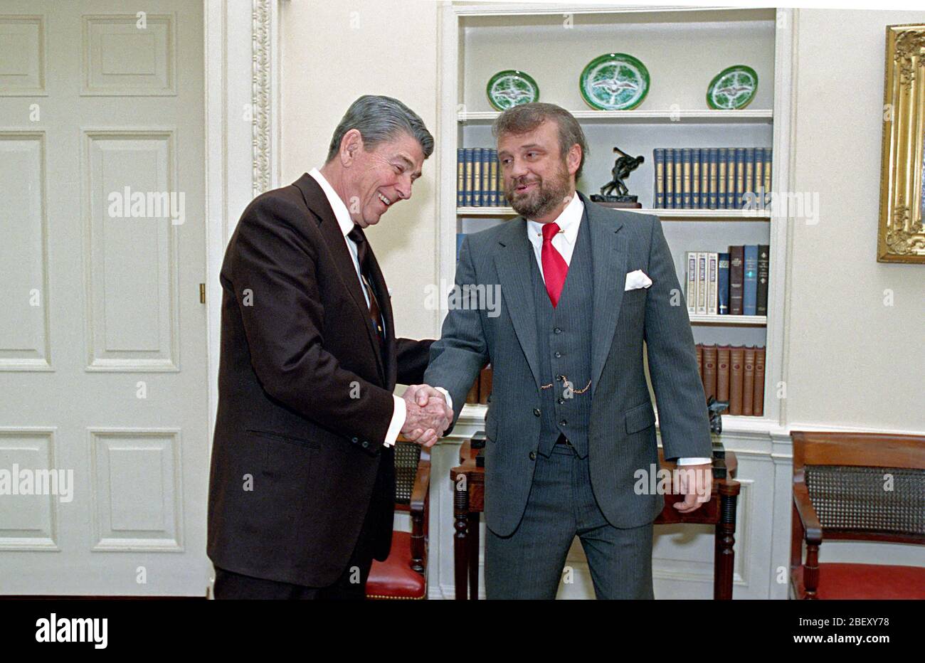 1/13/1989 President Reagan during a photo op. with Tony Dolan in the Oval Office Stock Photo