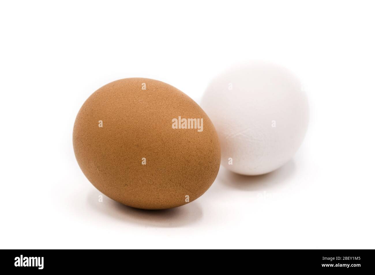 Brown and white eggs isolated on white background Stock Photo