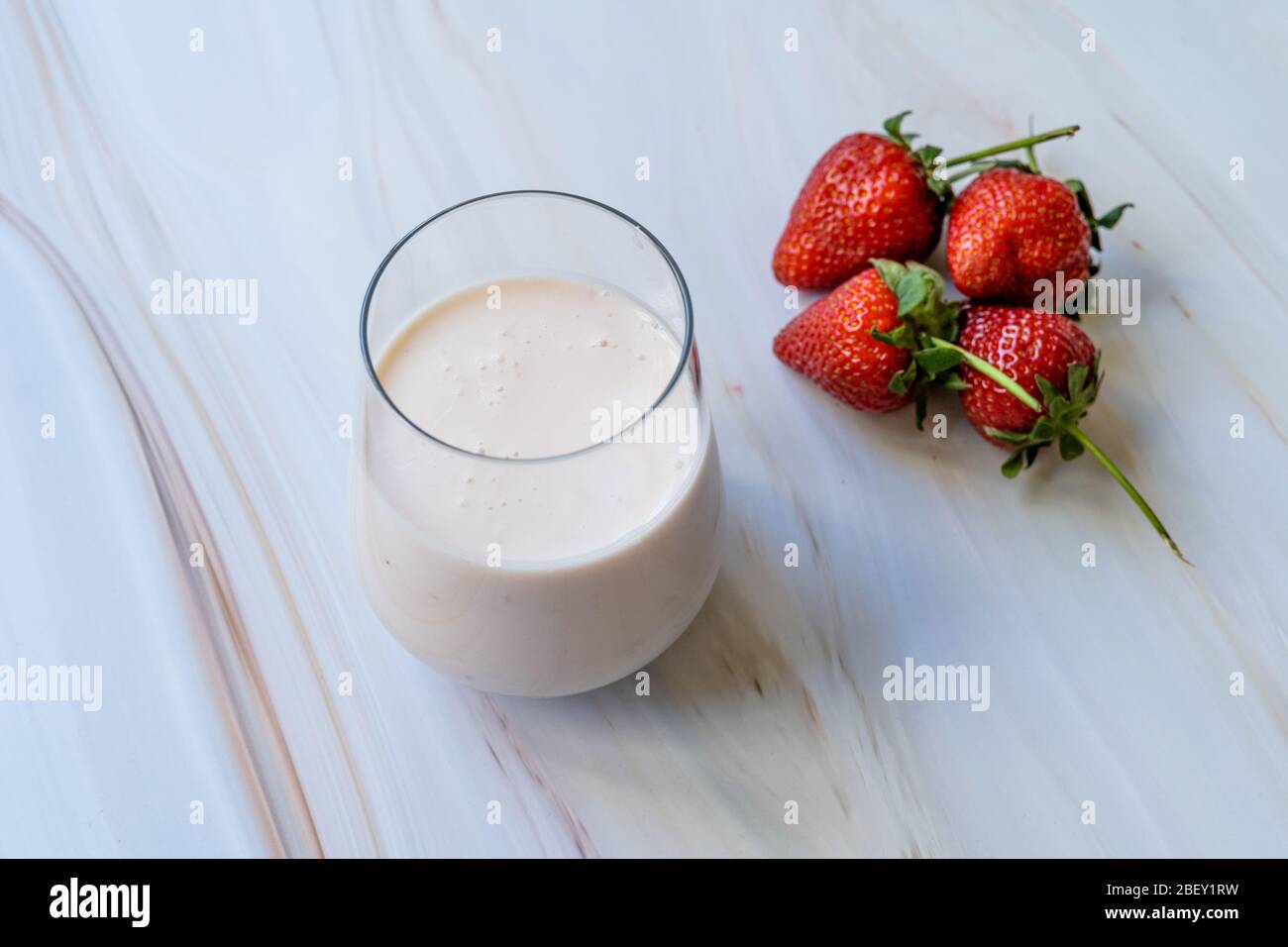 Kefir. Healthy Organic Drinkable Yogurt with Strawberries Fruit in