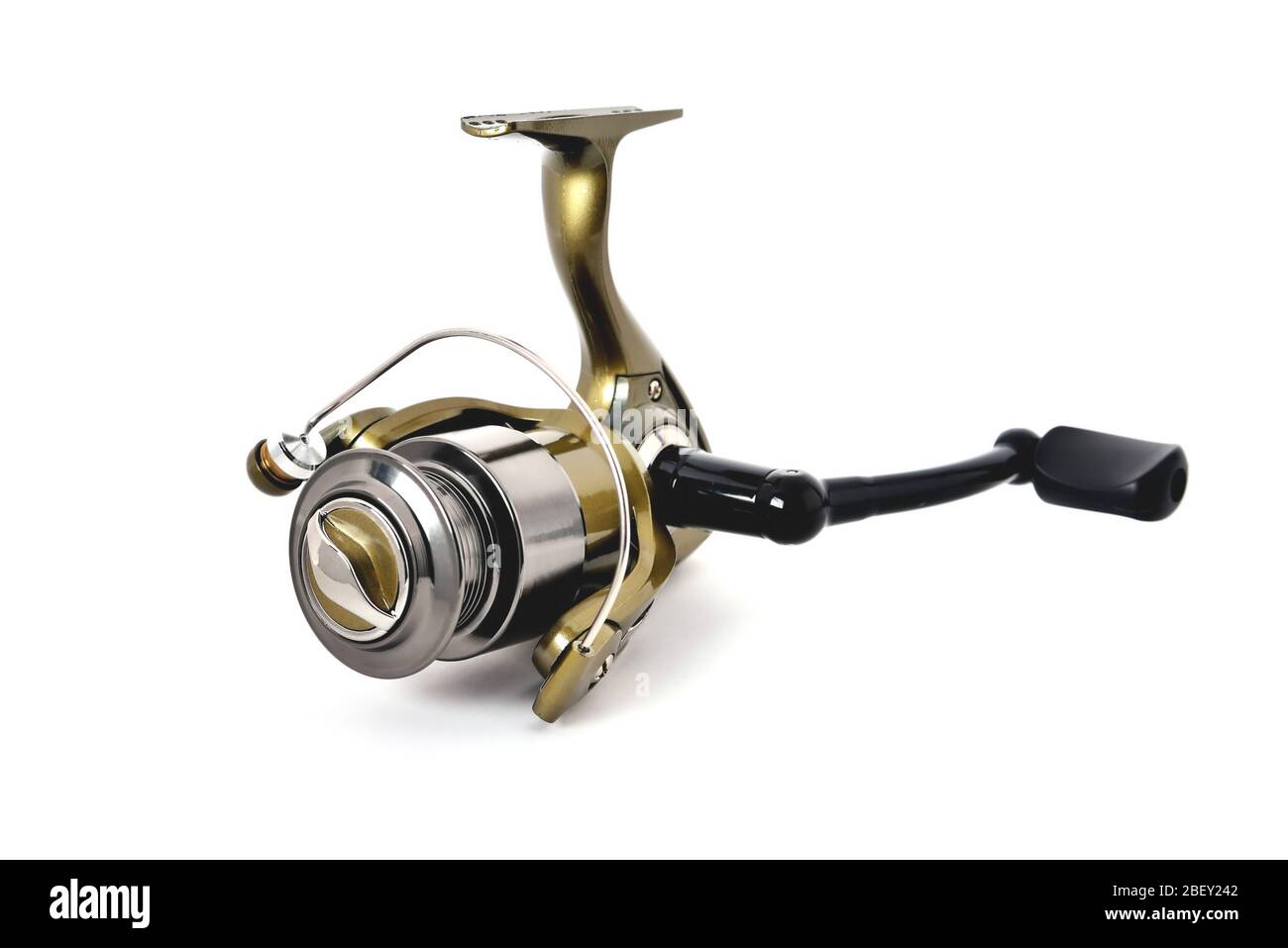 gold color fishing reel on a white background Stock Photo Alamy
