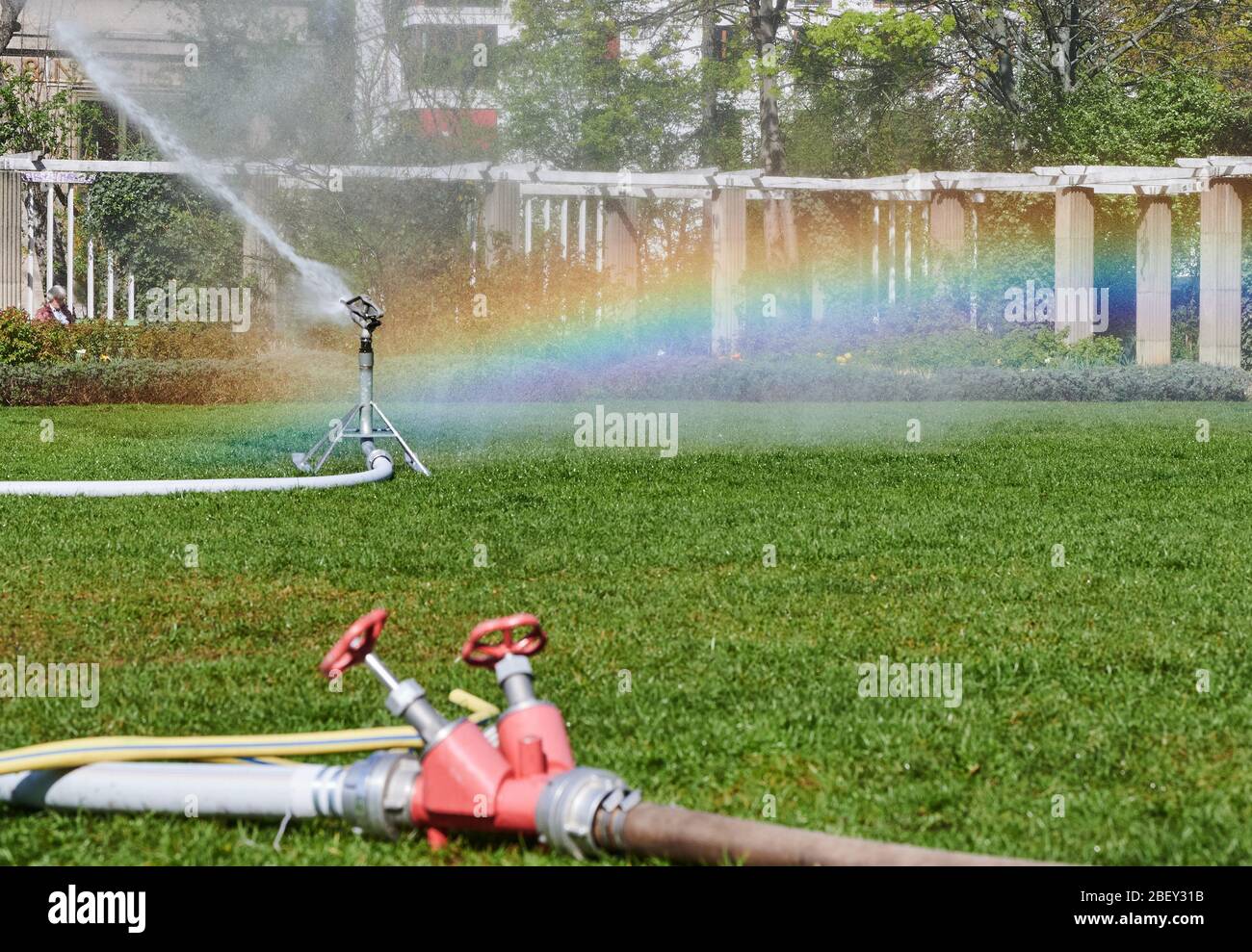Berlin, Germany. 16th Apr, 2020. The water drops of a lawn sprinkler create  a light reflection in rainbow colours. It hardly rains in Berlin at the  moment. Credit: Annette Riedl/dpa/Alamy Live News