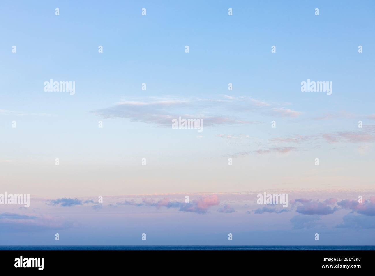 Clouds over the sea catching the pre dawn light,  Playa San Juan, Tenerife, Canary Islands, Spain Stock Photo