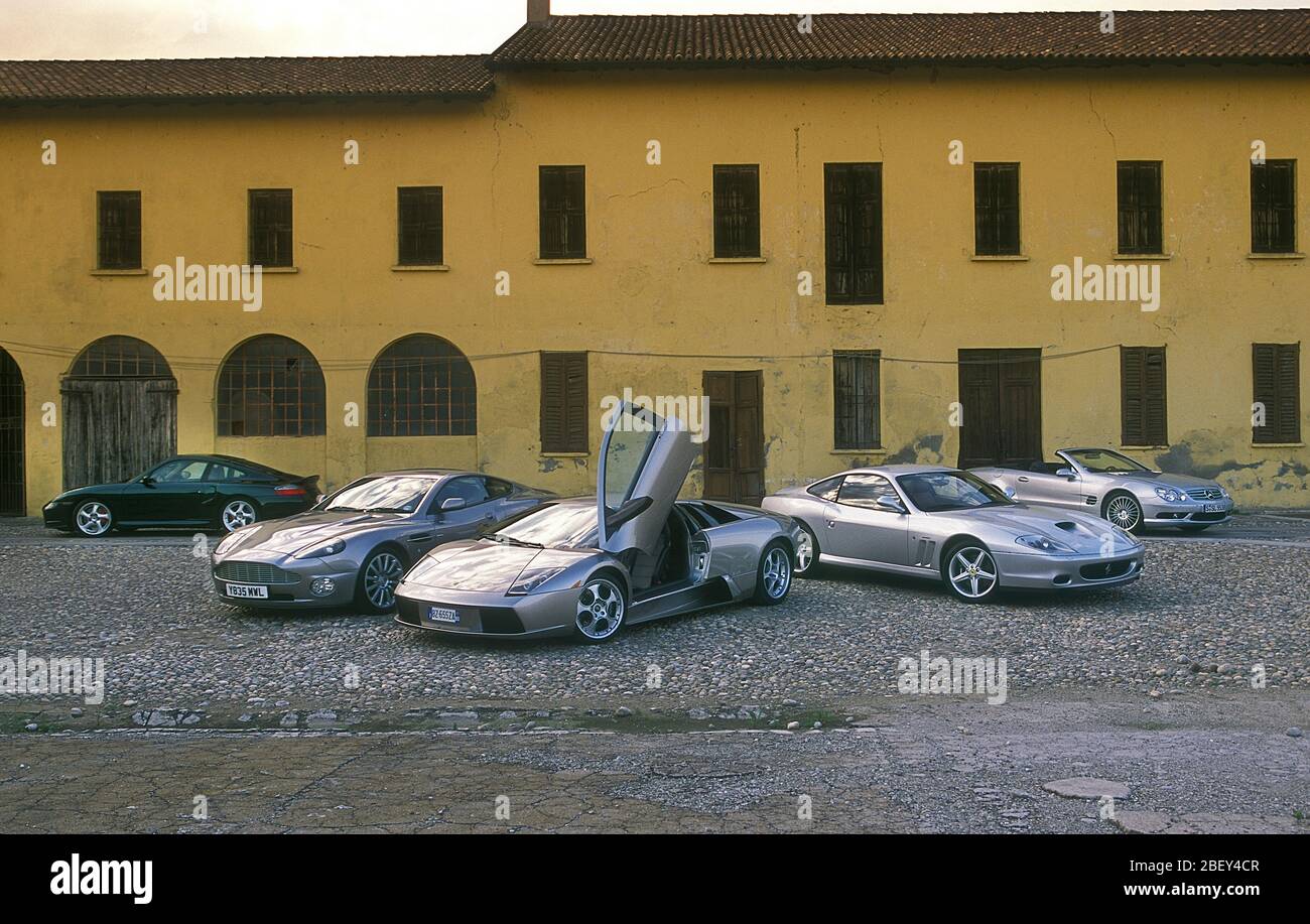 2002 super car group on test in Italy. Ferrari 550 Maranello, Lamborghini Marcalardo,Porsche 911 Turbo, Mercedes-Benz SL V8and Aston martin Vanquish Stock Photo