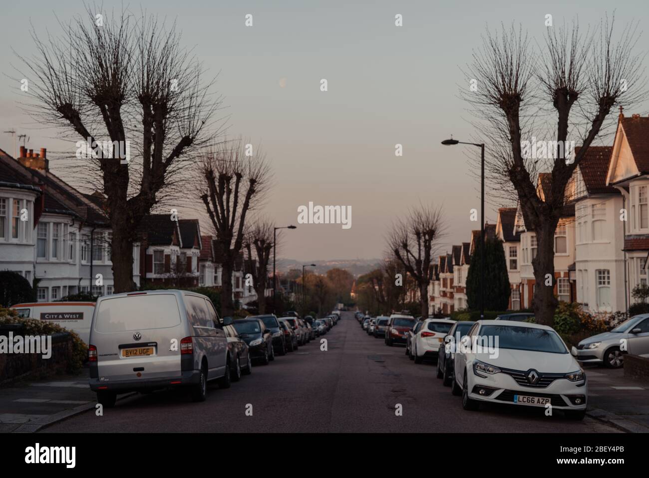 London, UK April 12, 2020 Cars parked on both sides of a street in