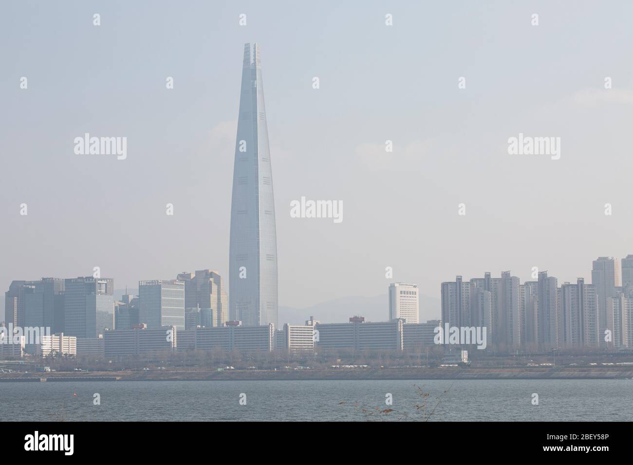 Lotte world Tower and buildings covered with fine dust, Songpa-gu, Seoul, Korea-  08 Feb 2020 Stock Photo