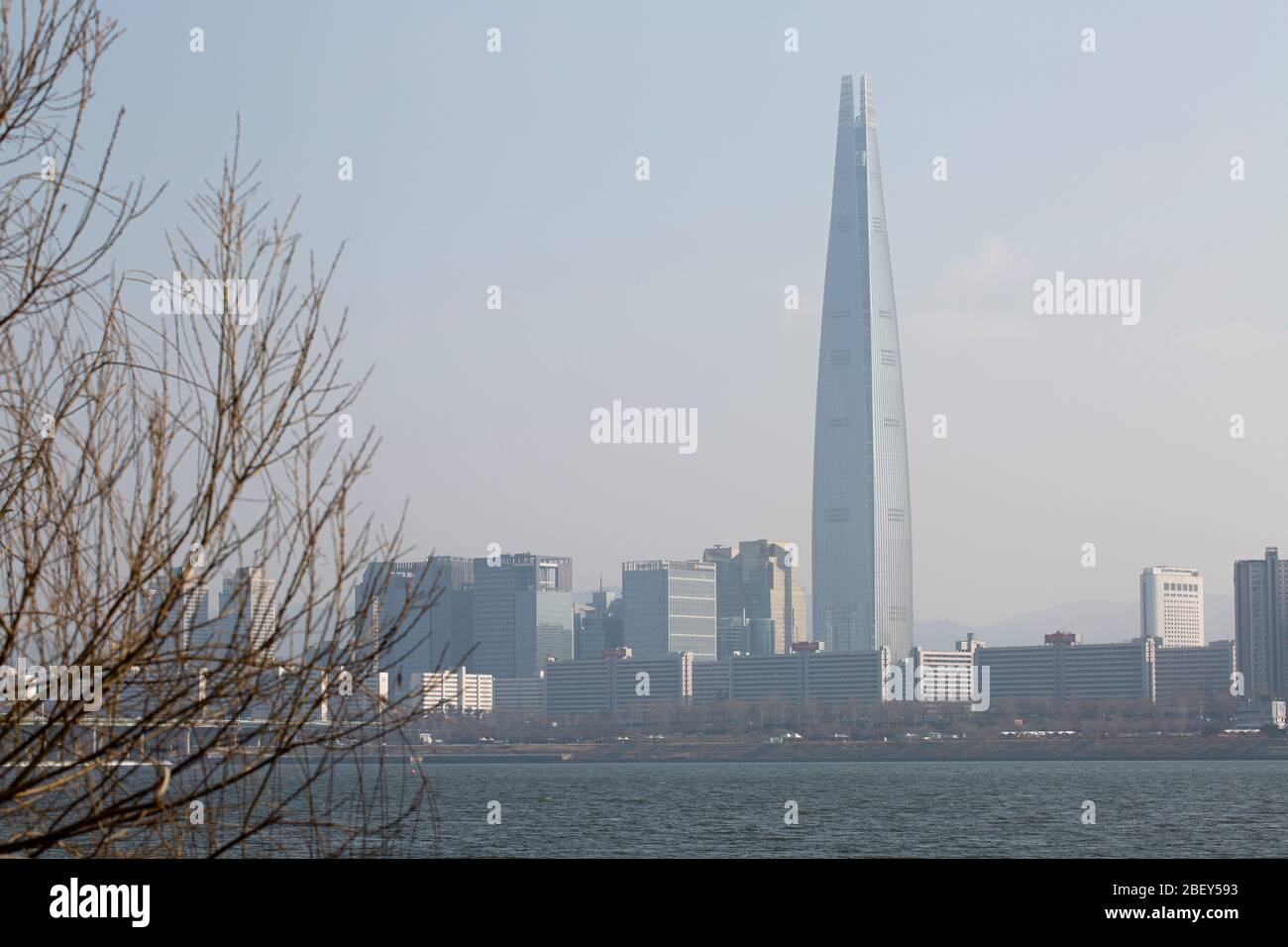 Lotte world Tower and buildings covered with fine dust, Songpa-gu, Seoul, Korea-  08 Feb 2020 Stock Photo