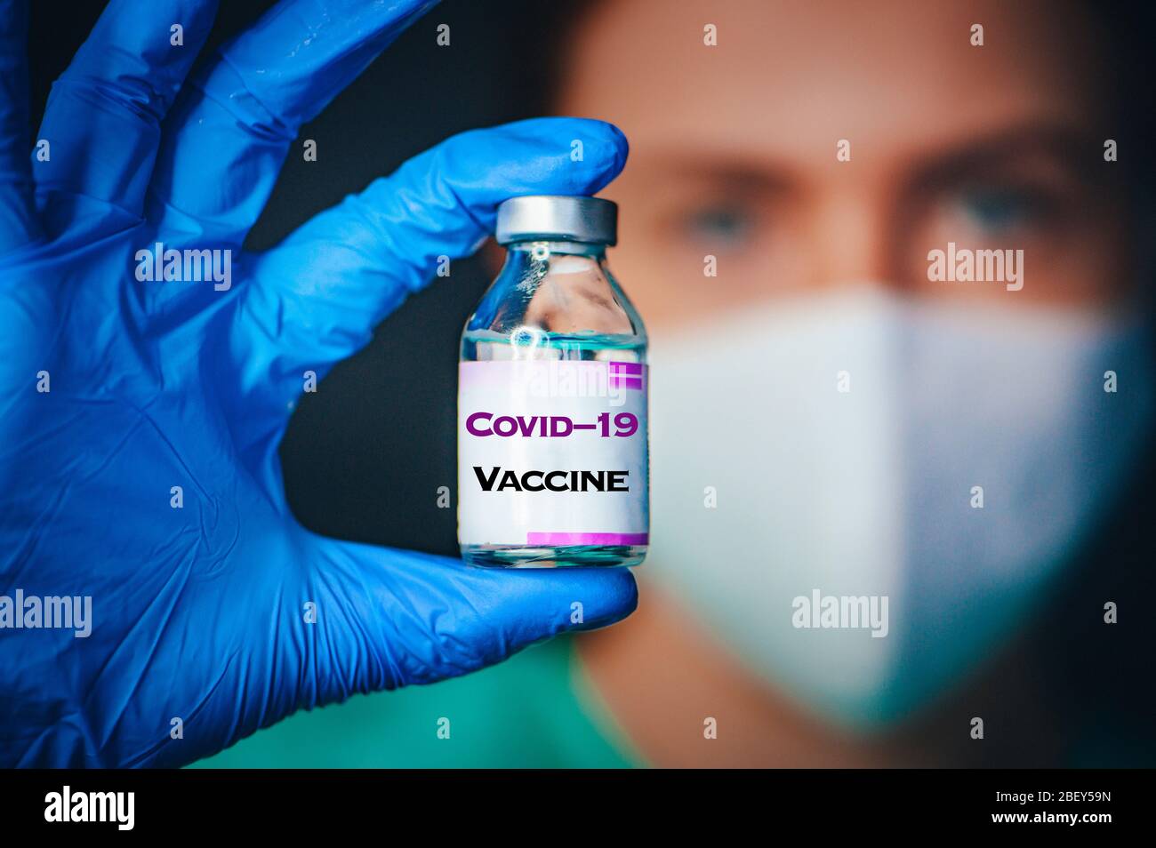 Doctor looking at glass vials