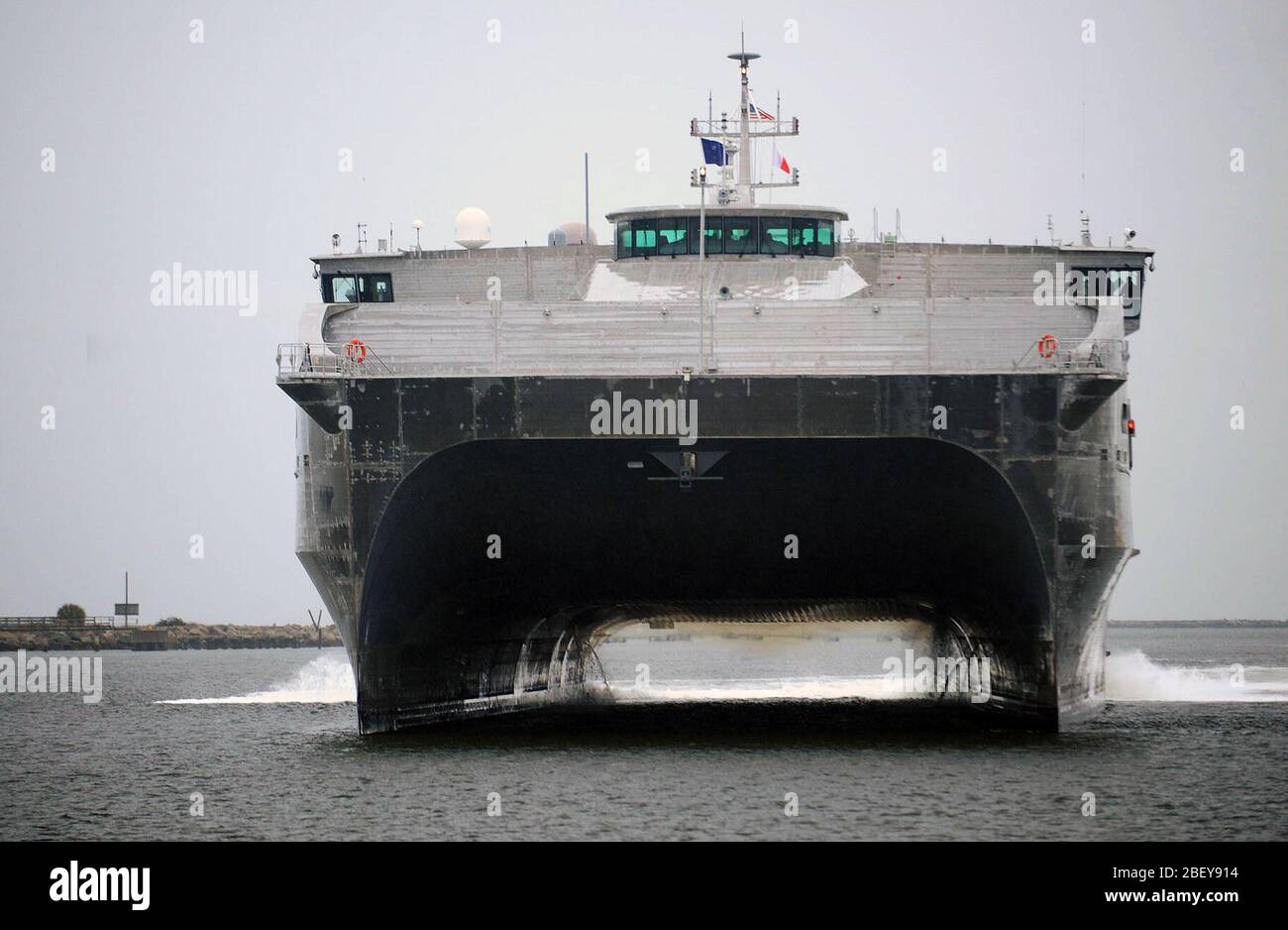 MAYPORT, Fla. (Feb. 14, 2013) The Military Sealift Command joint high-speed vessel USNS Spearhead (JHSV-1) pulls into Naval Station Mayport to be inspected by Rear Adm. Sinclair M. Harris, commander of U.S. 4th Fleet. Spearhead is the first of of nine Navy joint high-speed vessels and is designed for rapid intra-theater transport of troops and military equipment. Stock Photo