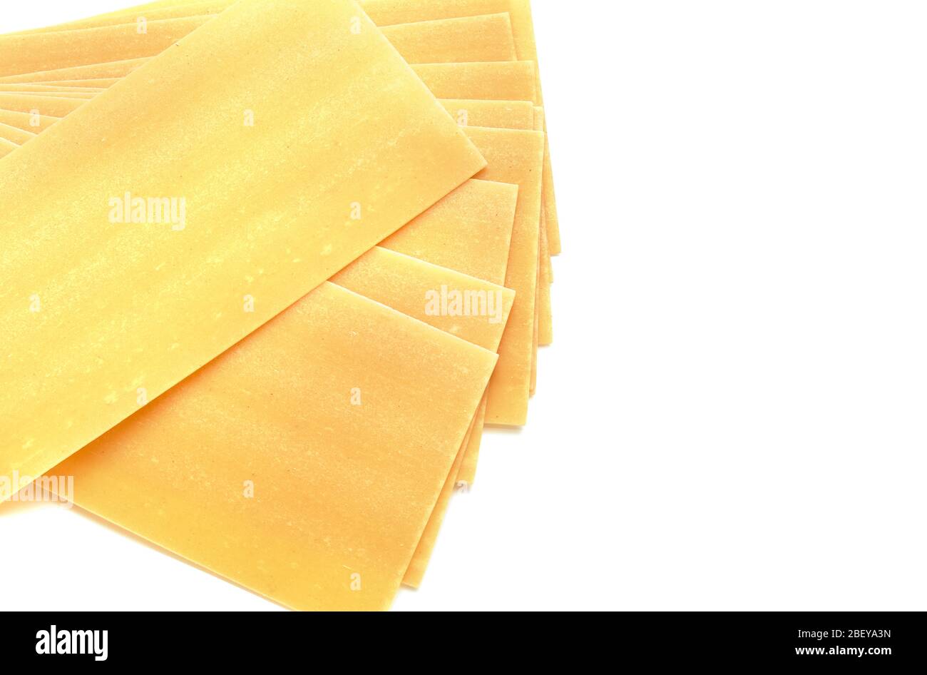 Dried lasagna pasta sheet isolated over the white background Stock