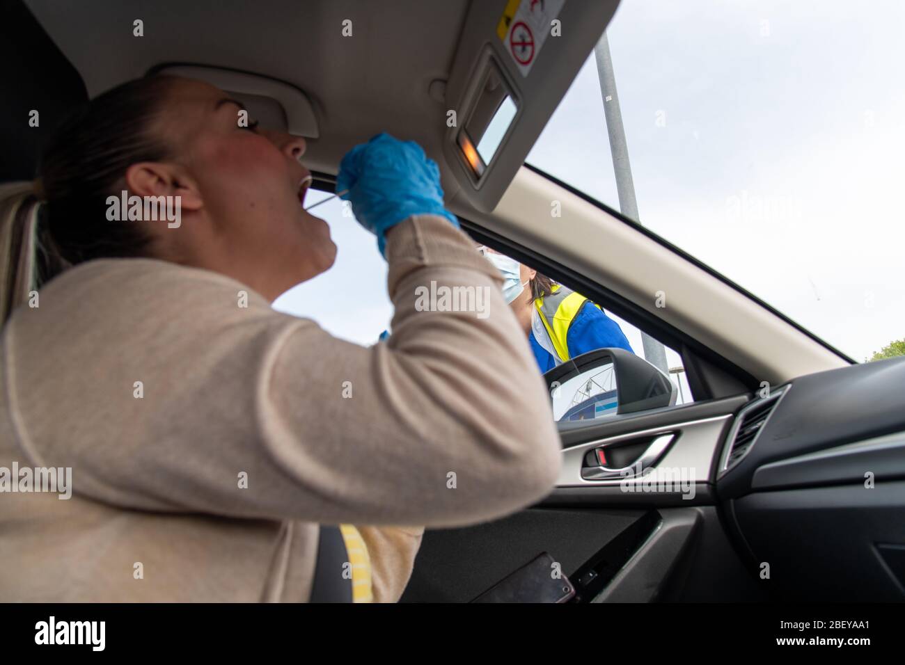 A woman being tested for coronavirus Covid-19 at the testing drive through centre at Cardiff City Stadium, Wales Stock Photo