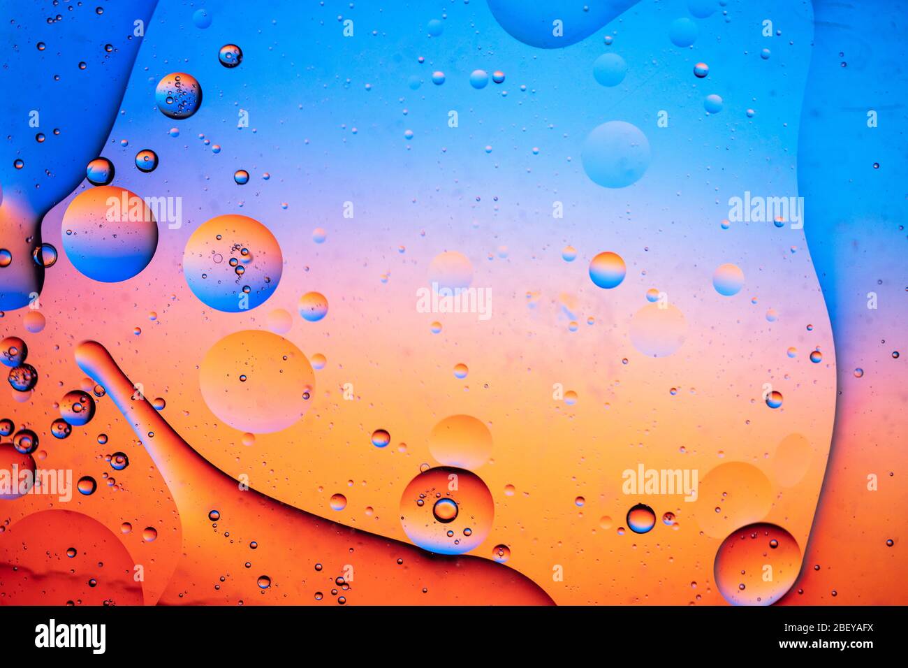 Abstract colourful creative macro oil and water background with bubbles ...