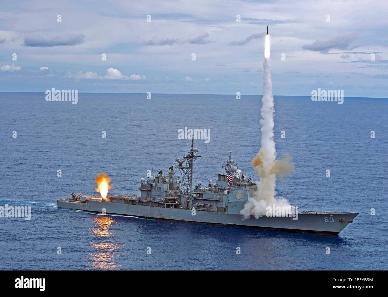 PACIFIC OCEAN (Sept. 20, 2012) The Ticonderoga-class guided-missile cruiser USS Cowpens (CG 63) fires Standard Missiles (SM) 2 at an airborne drone during a live-fire weapons shoot. Cowpens is part of the George Washington Carrier Strike Group, the U.S. Navy’s only forward deployed carrier strike group, and is conducting a routine patrol of the western Pacific region. Stock Photo