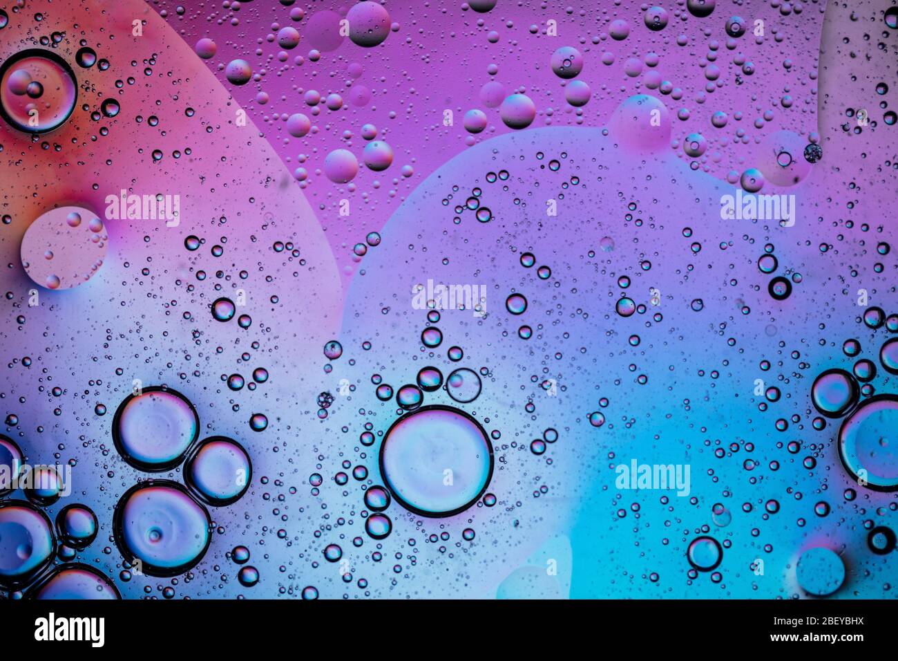 Abstract colourful creative macro oil and water background with bubbles ...
