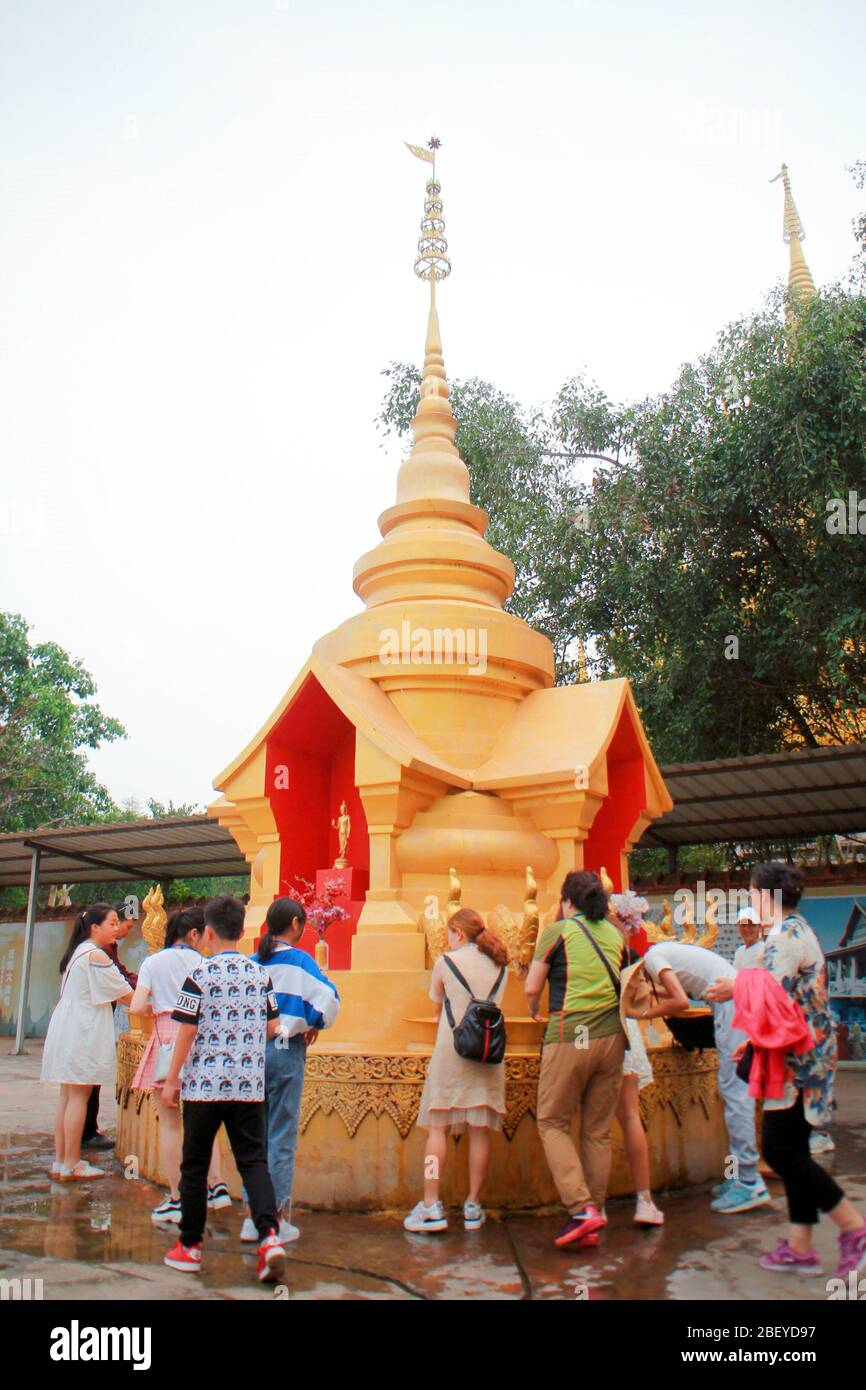 Yunnan, China. 16th Apr, 2020. Yunnan xishuangbanna dai autonomous prefecture, meng however jinzhou.would is the royal temple in ancient dai dynasty ''scene floating buddhist temple'' site restoration and reconstruction of south-east Asia's biggest southern Buddhism temple, Buddha sakyamuni's life and the buddhist temple activities as the main line, cleverly integrated into the landscape and architecture group, fully demonstrate the history of the southern Buddhism and the traditional culture, national key cultural relics protection units, and tourists t Credit: ZUMA Press, Inc./Alamy Live New Stock Photo