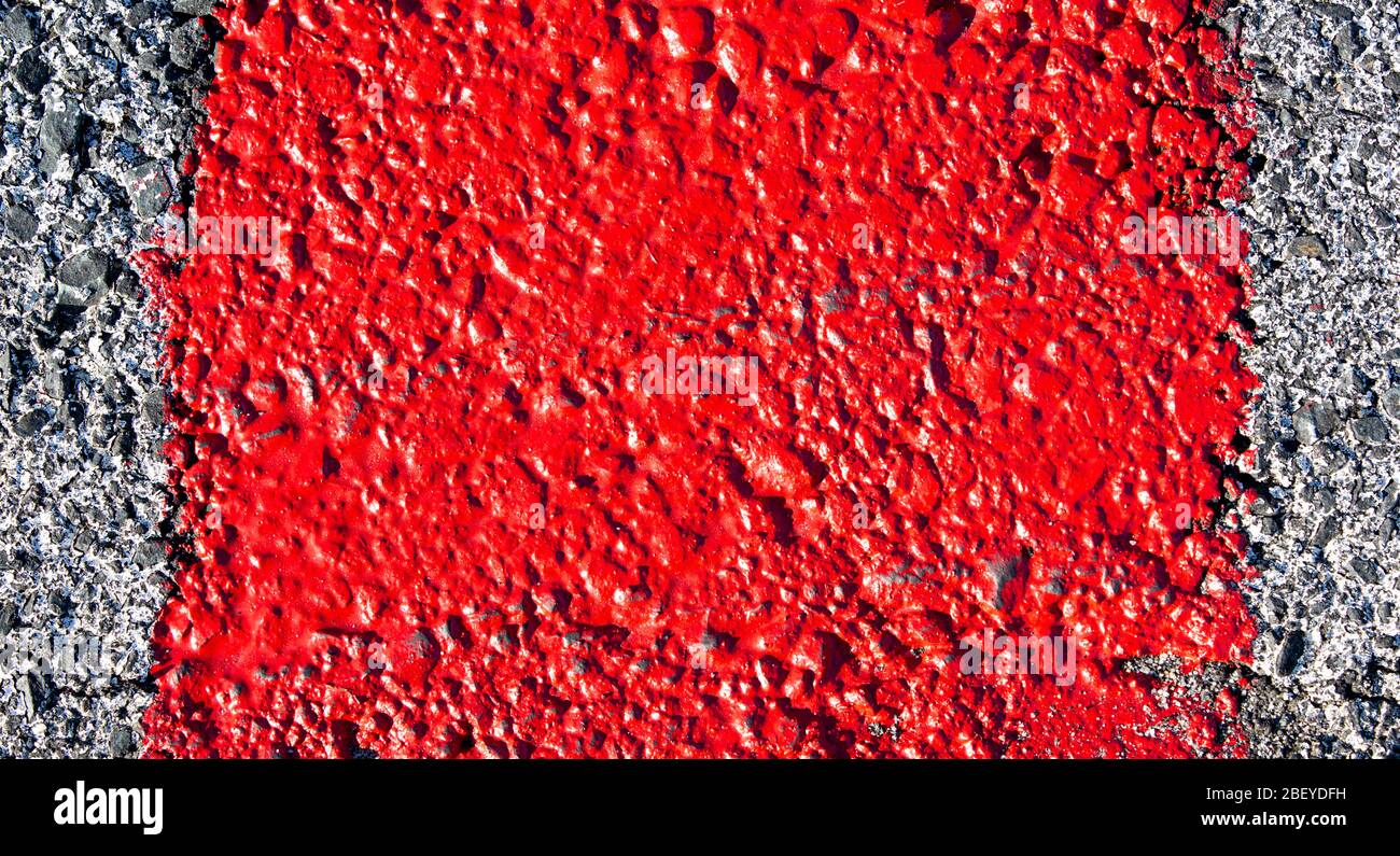Tarmac surface painted red and white Stock Photo