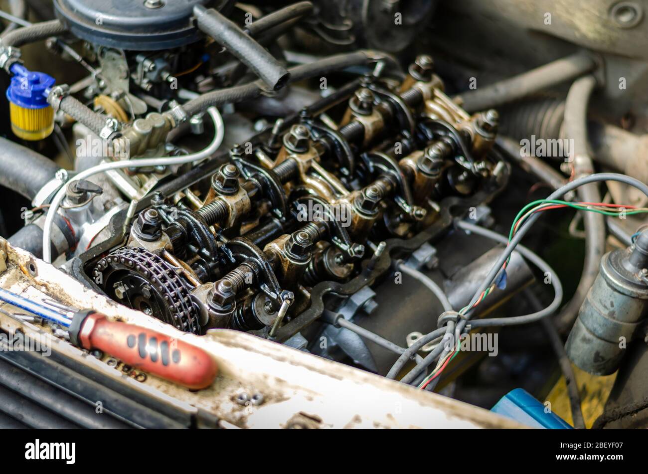 Engine compartment of a passenger car. Detailed shot of a carburetor