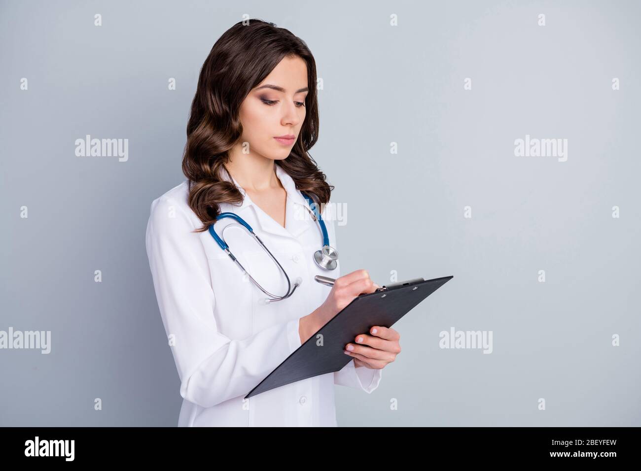 Photo of beautiful family doc lady hold patient papers medical