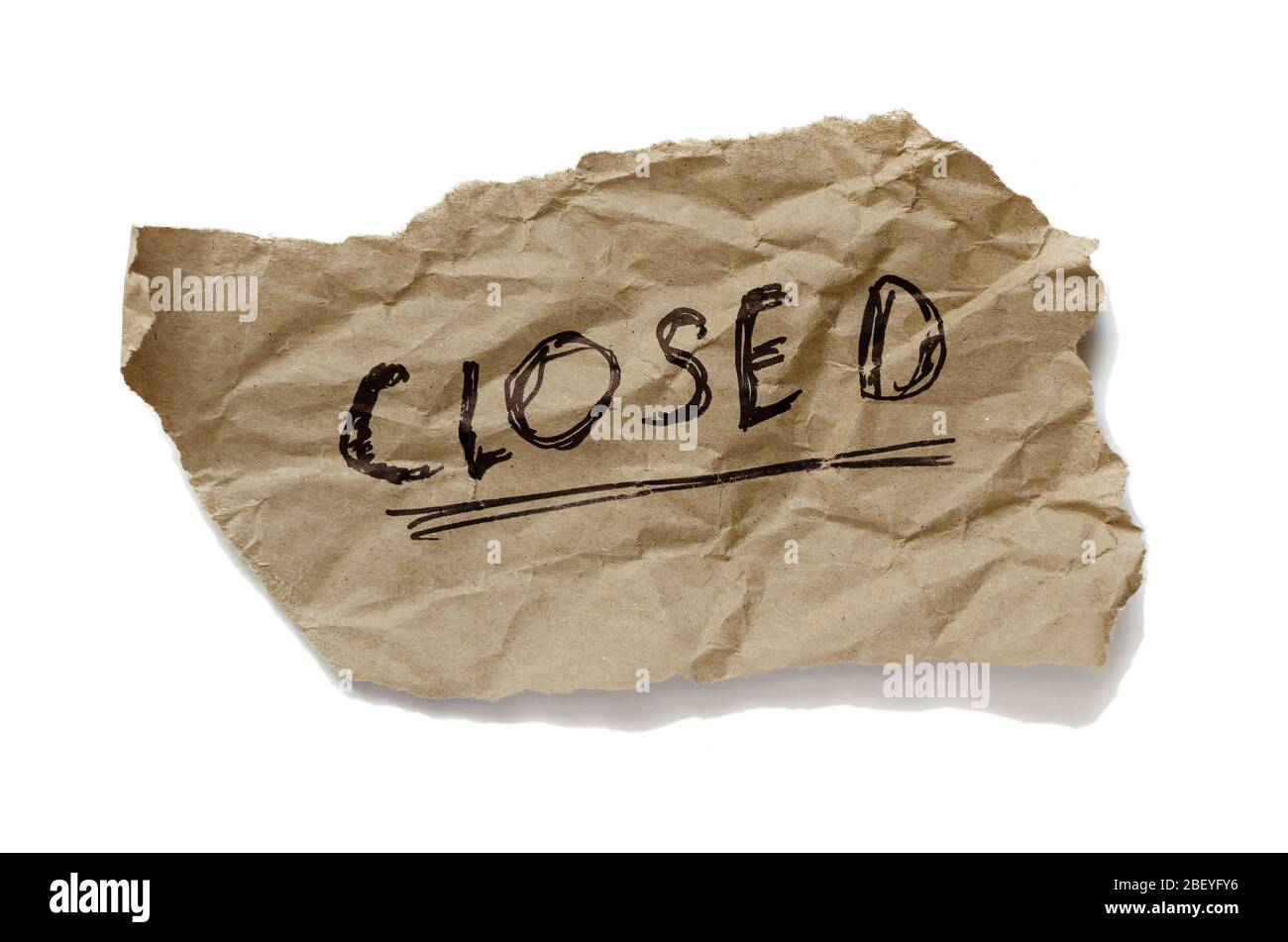 A scrap of torn paper with the word closed. Handwritten inscription on ...