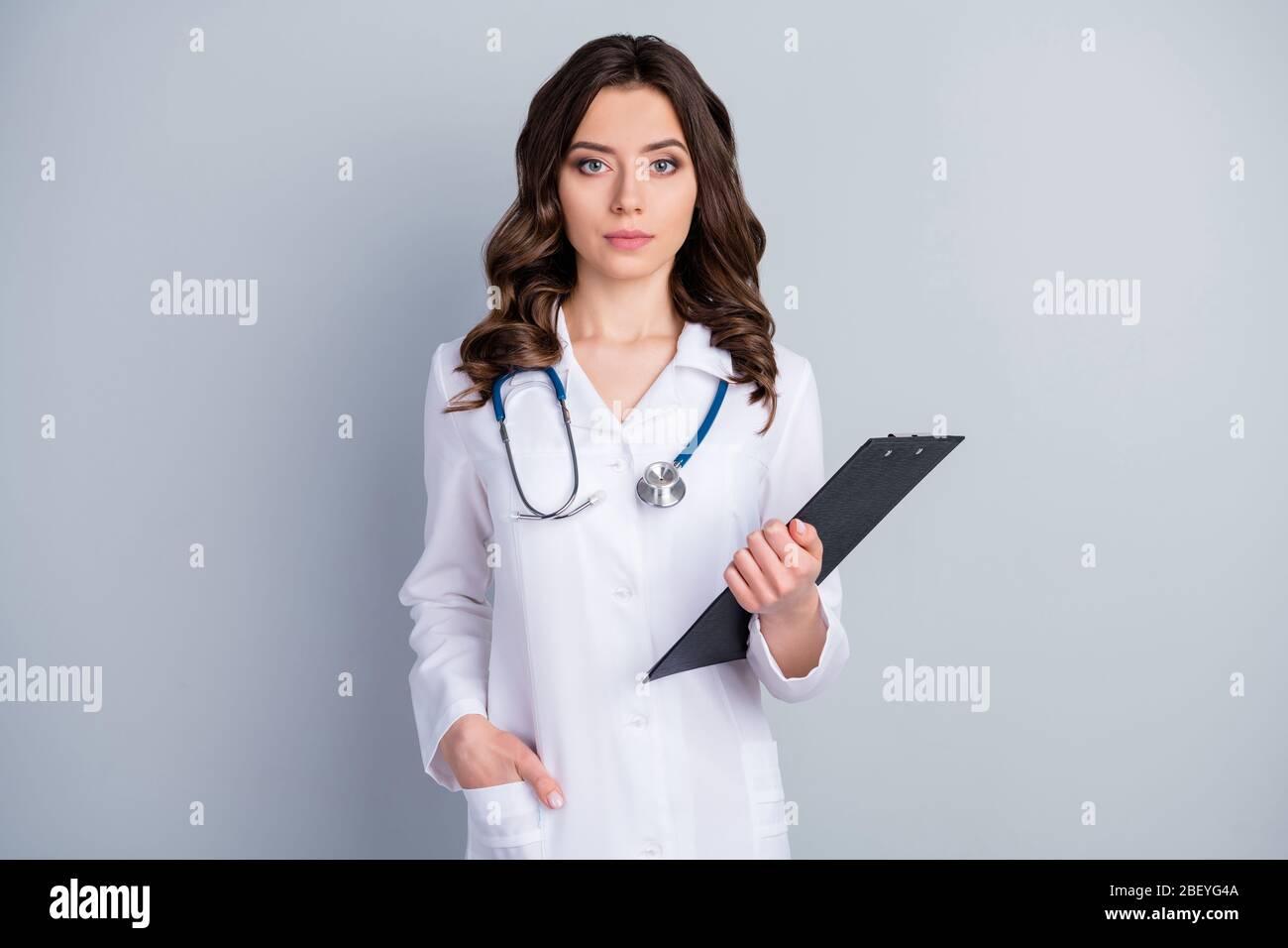 Photo of beautiful professional doc practitioner intern lady hold