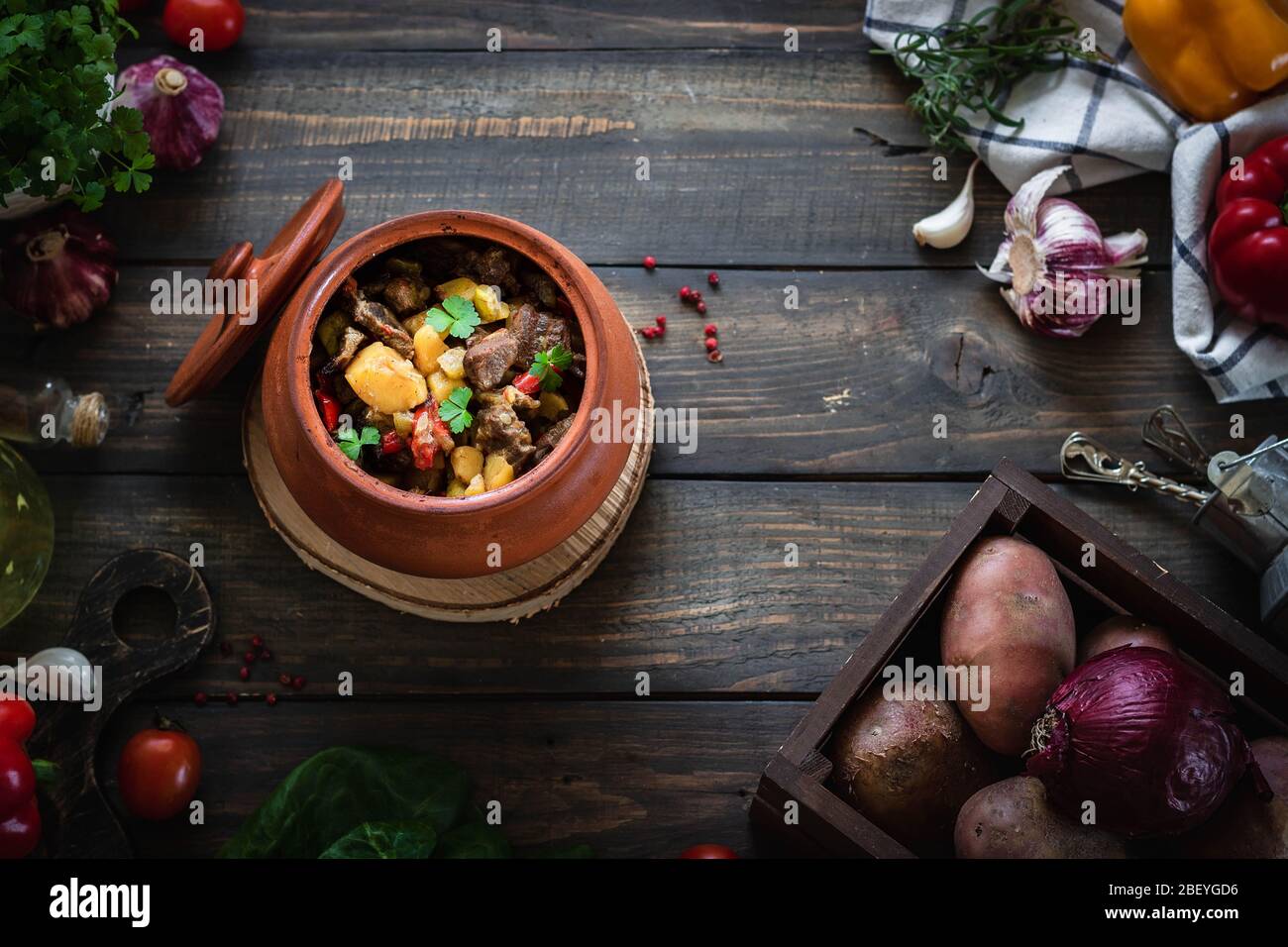 Roast in a clay pot in a rustic style. Braised beef with vegetables ...