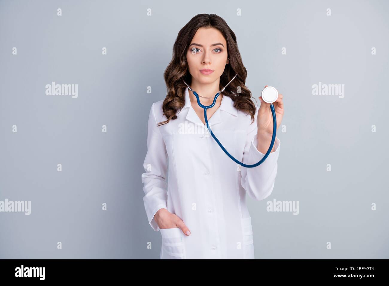 Photo of beautiful professional family doc lady examining patient using