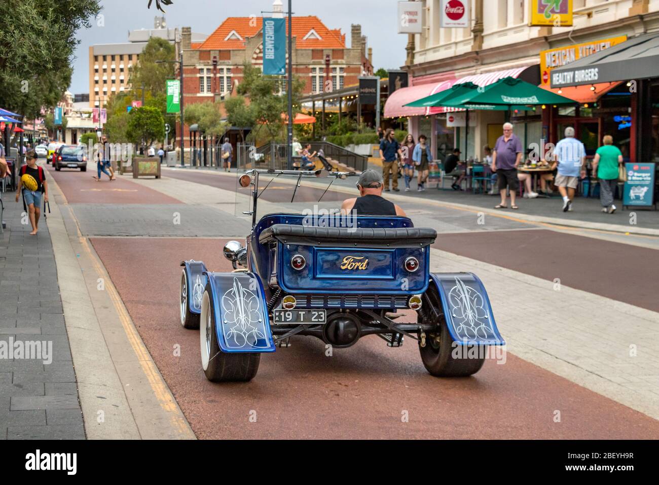 An old vintage Ford car on the South Terrace street at the city center of Fremantle, Australia. Stock Photo